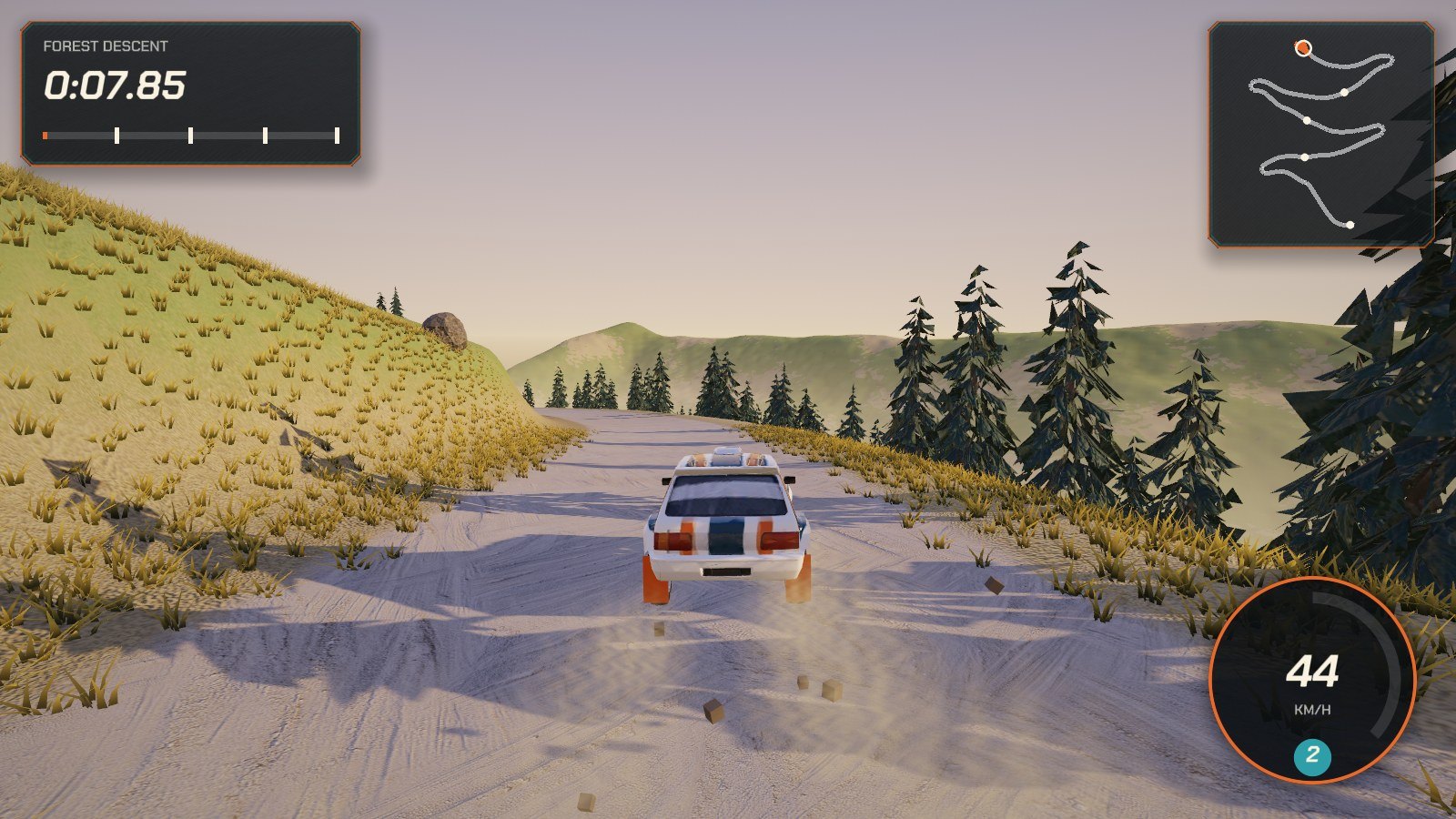 A white rally hatchback with orange and teal stripes sliding through a gravel bend on a mountainside, kicking up dust, with pine trees and distant ridges behind and a speedometer reading 44 km/h.